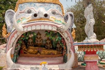reclining Buddha inside the mouth of a god