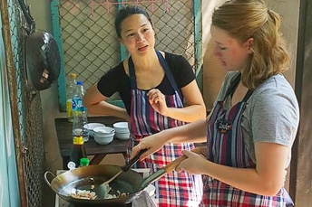 woman cooking in a wok