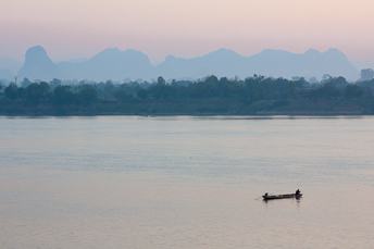 boat on mekong river at sunrise