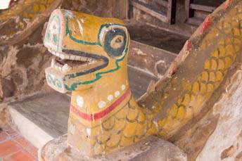 old naga along stairs in front of an ubosot