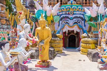 Buddha and many other statues at a temple