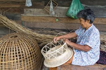 woman weaving rattan