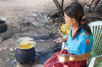 woman spinning silk thread